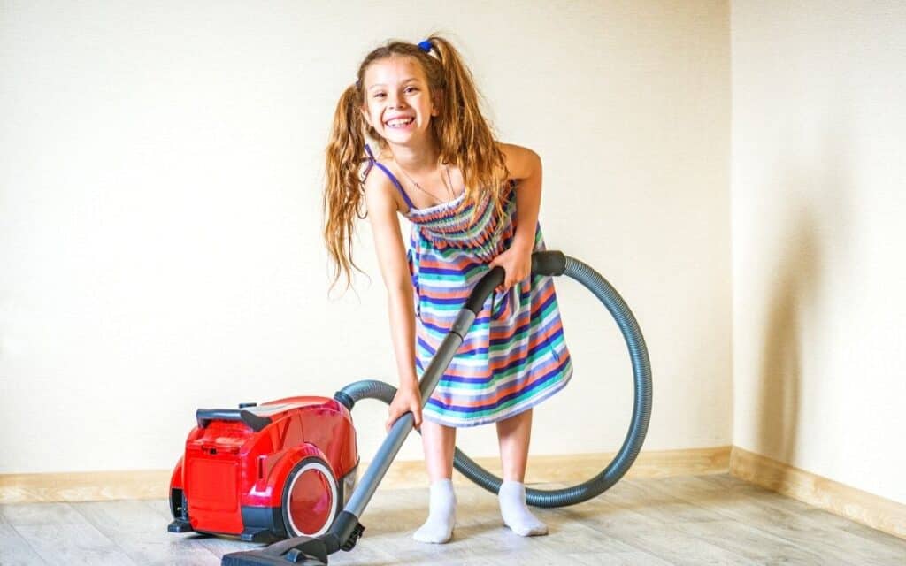 happy kid doing chores