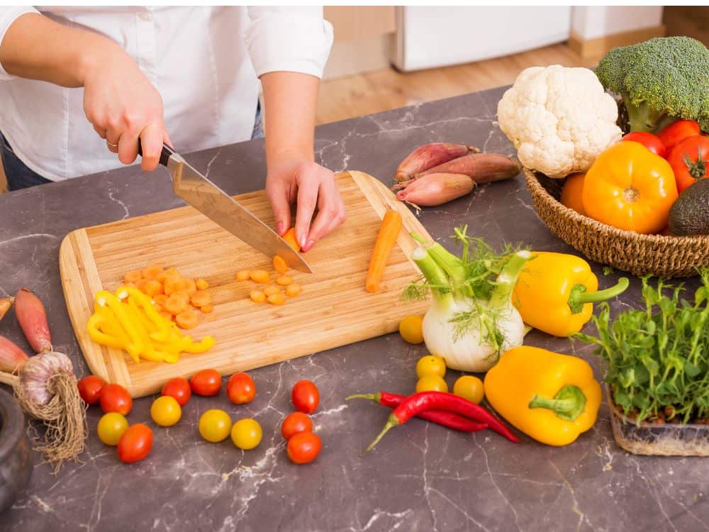 person chopping vegetables