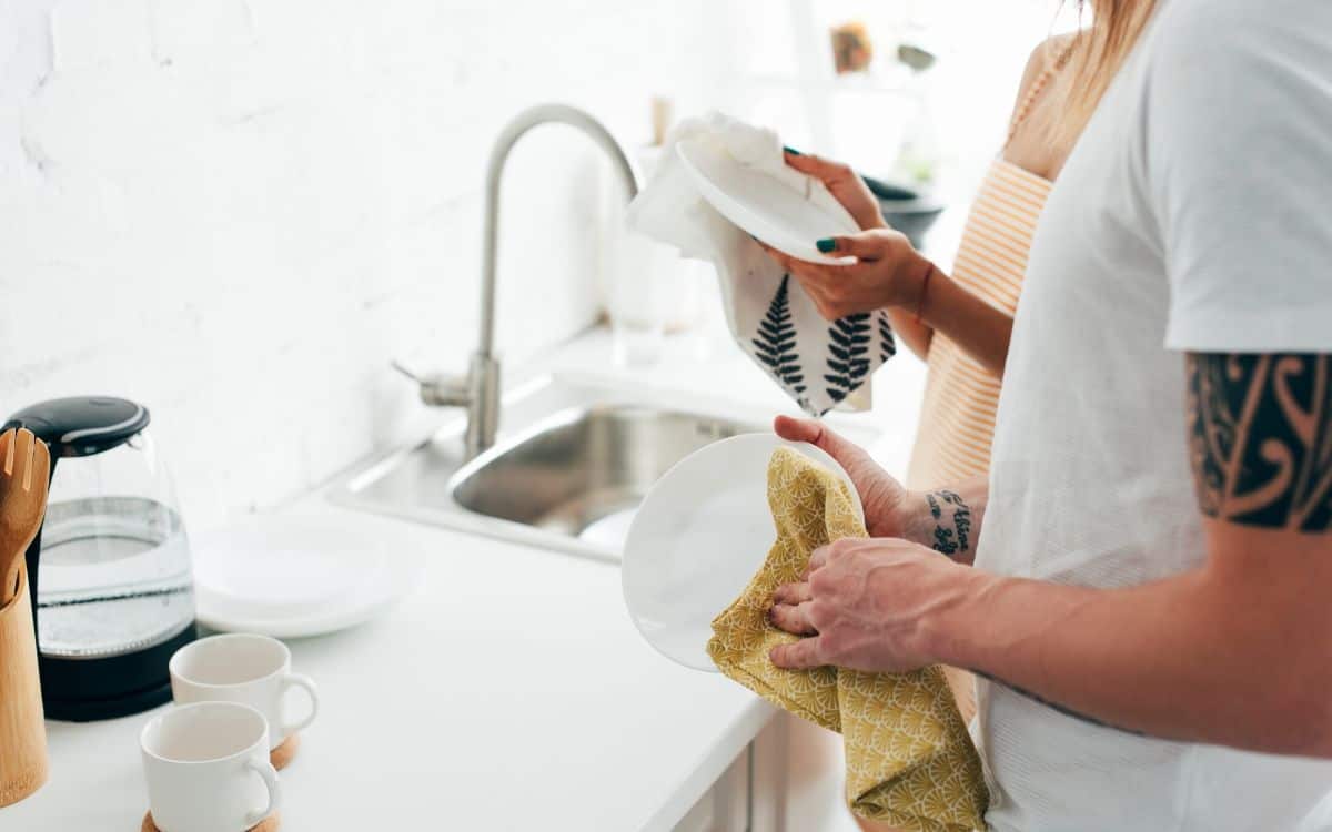 washing dishes to keep home clean